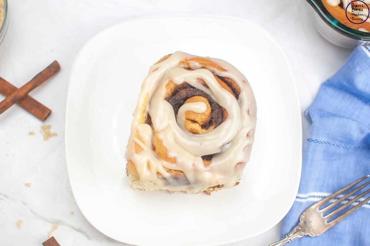 Overnight Sourdough Cinnamon Rolls Recipe on a white plate