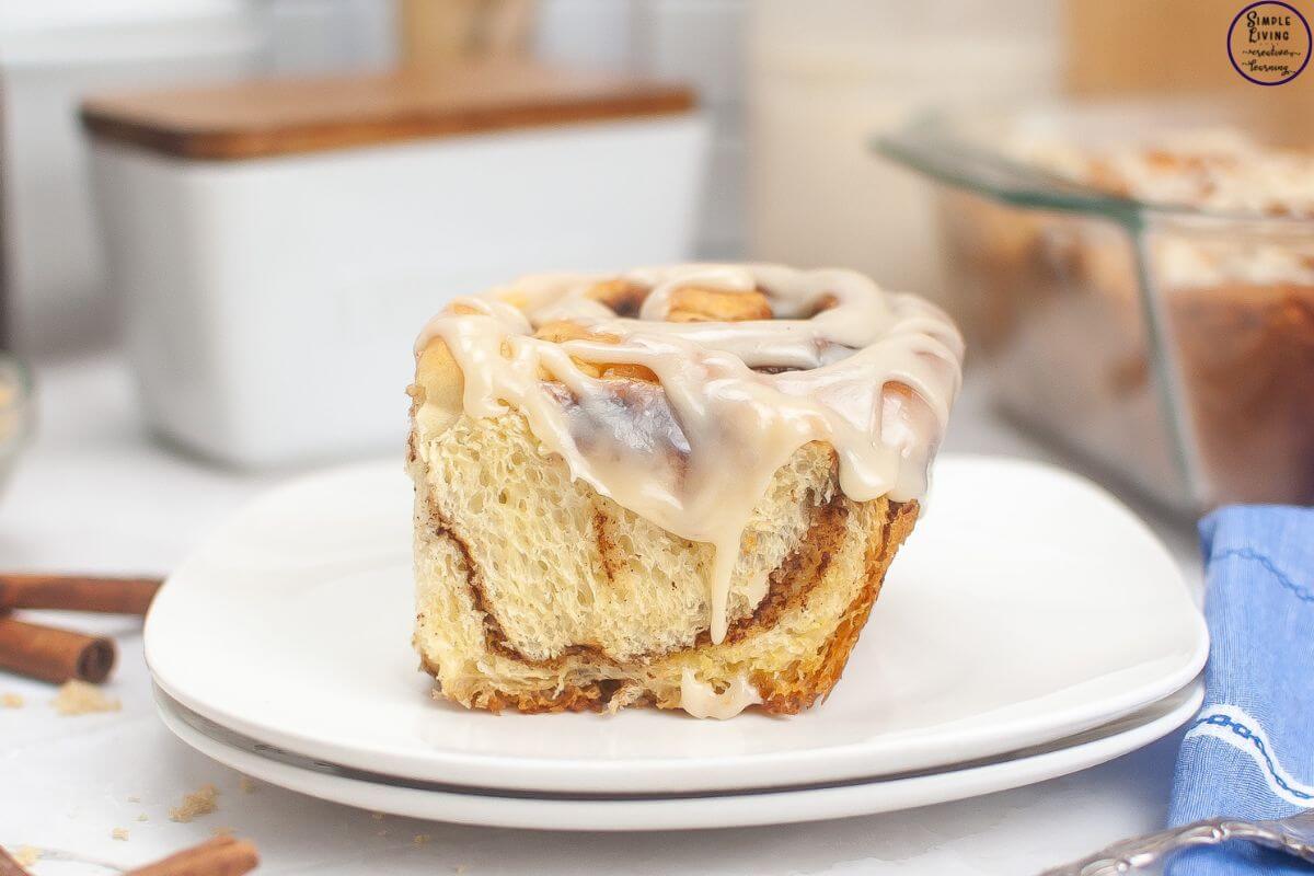 Overnight Sourdough Cinnamon Rolls Recipe on a plate looking at the side