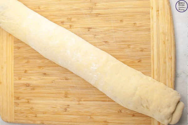 Overnight Sourdough Cinnamon Rolls Recipe rolled into a roll