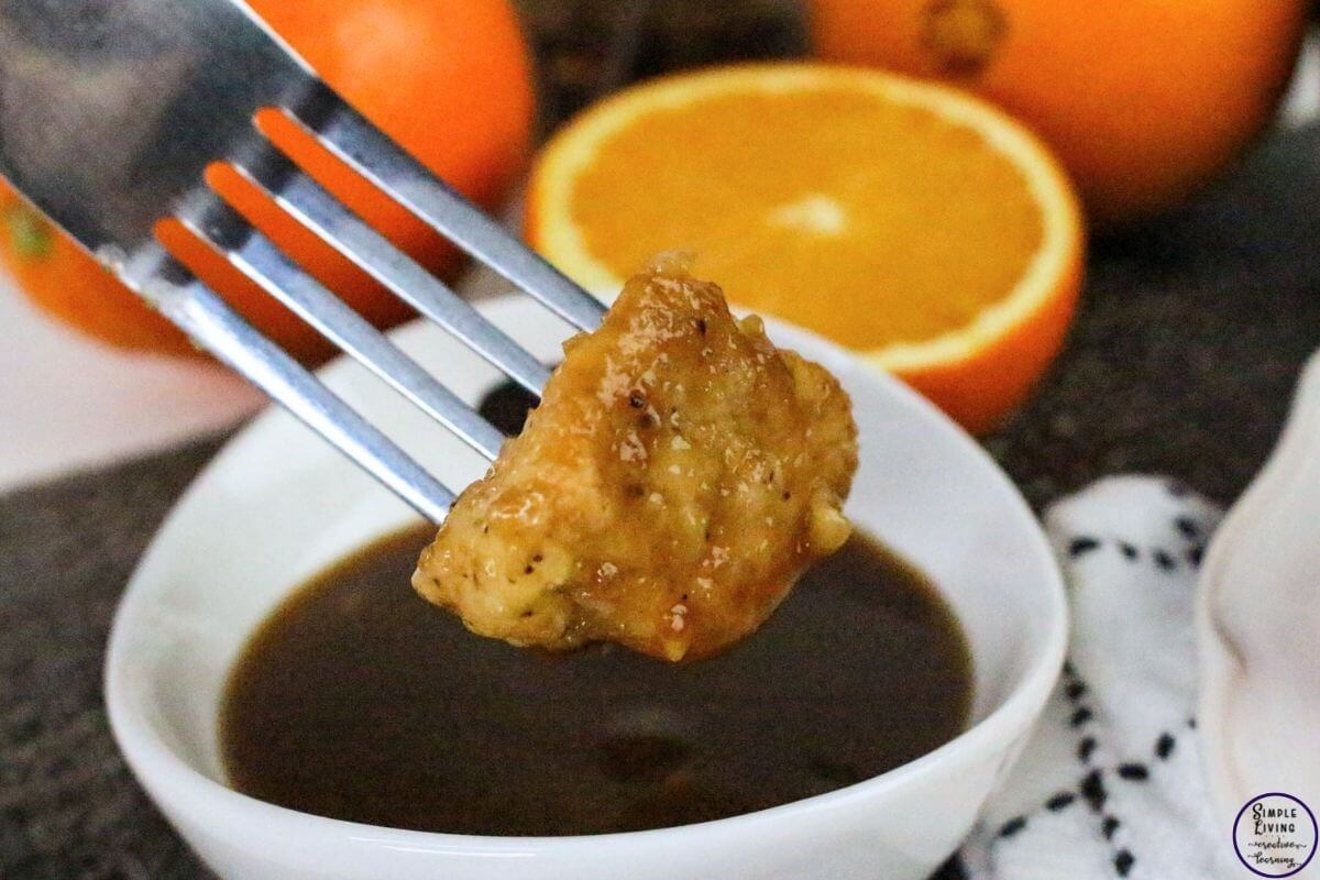 Orange Chicken Recipe chicken on a fork up close
