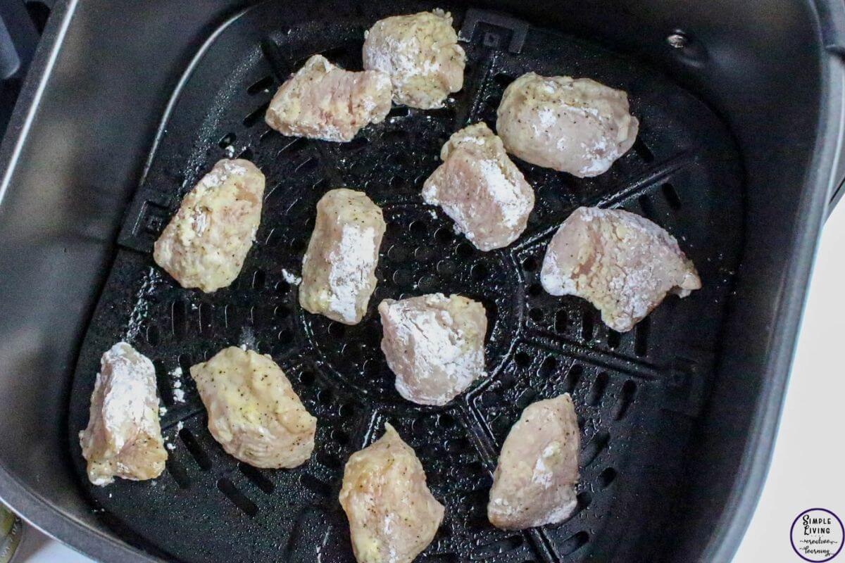 Orange Chicken Recipe raw chicken going in air fryer to be cooked