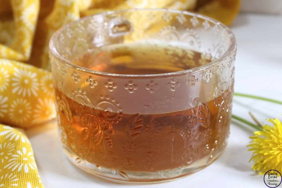 Homemade Dandelion Tea in a glass cup ready to drink