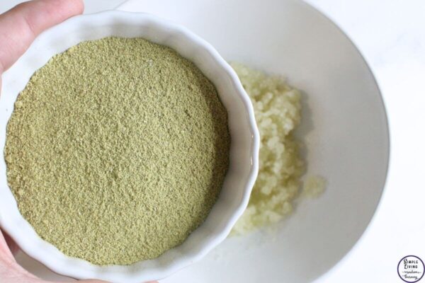 homemade scalp scrub adding rosemary powder