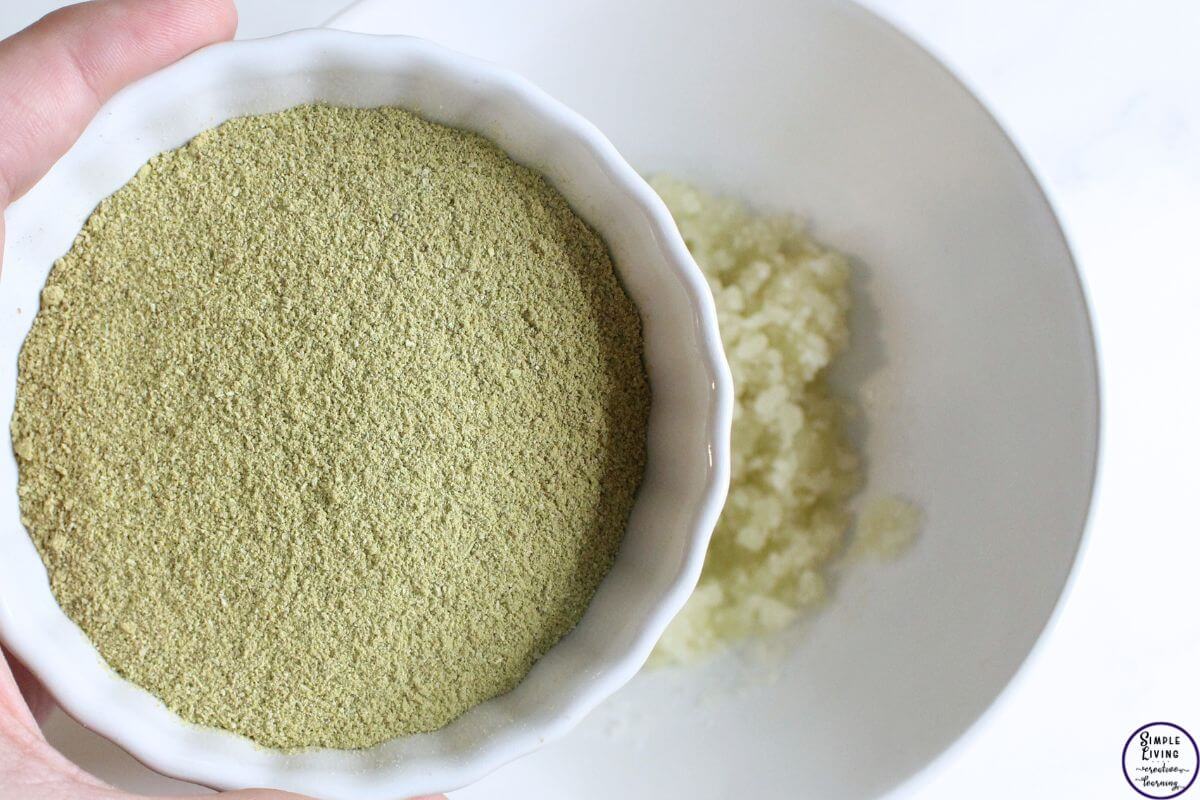 homemade scalp scrub adding rosemary powder