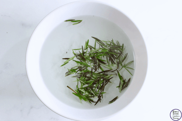 Rosemary Spray for Hair adding rosemary to water
