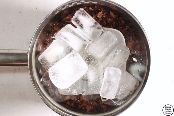 Homemade Rose Hydrosol adding ice cubes