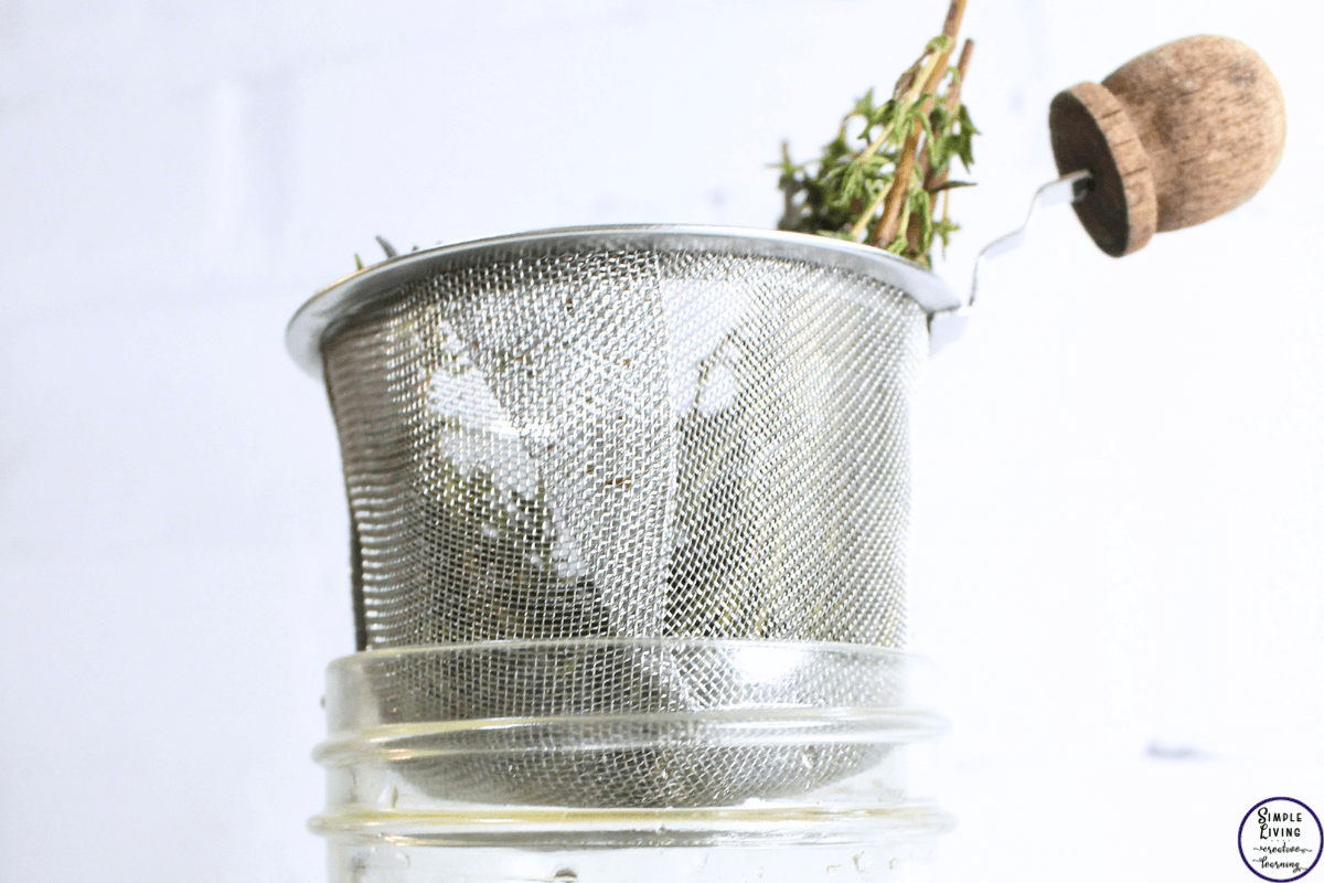 Thyme Cough Syrup straining the mixture